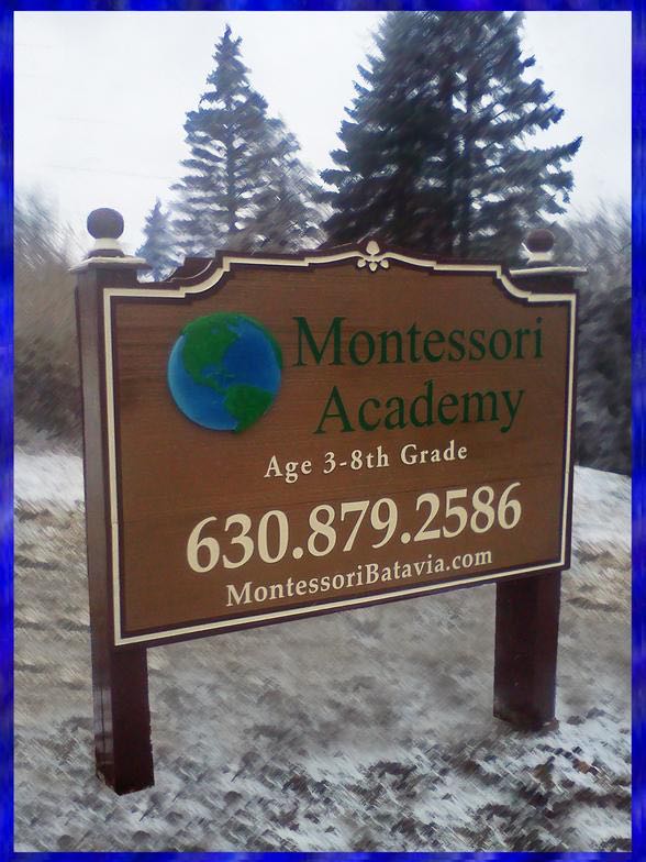 Carved Montessori Academy sign
